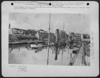 Thumbnail for Consolidated > Large drydock, containing damaged 280-foot merchant vessel & 150-foot coaster (2 & 3 on vertical 27493 A.C.) was flooded by Germans.