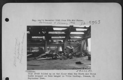 Thumbnail for Villacoublay > This Ju-88 Folded Up On The Floor When The 9Th Af Bombs Dropped On This Hangar In Villecoublay, Farnce 21 Sept. 1944.