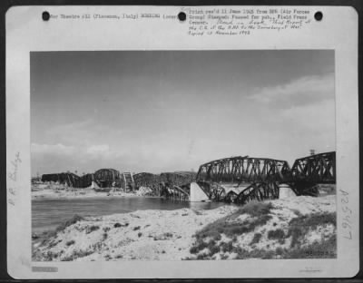 Consolidated > This railroad bridge at Piacenza, Italy was attacked by planes of the MAAF. This shot was made from the south Bank of the Po River showing the bombed railroad bridge. This is the only railroad bridge crossing the Po river at this point.