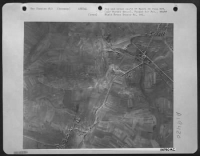 Thumbnail for Consolidated > The track-marked terrain (left center) in this aerial photograph taken from a 1st Tac. Air Force Martin B-26 Marauder reveals the site of a 7th Army tank battle with the enemy somewhere on the 6th Army Group front driving toward the Saar Palatinate.