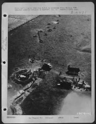 Consolidated > THE GREATEST AIRBORNE INVASION IN HISTORY--B-24 Liberators of the U.S. Army 8th Air Force winging in only 100 feet above the ground March 24th on their mission to drop supplies in the Wesel area, made this photograph of Allied anti-aircraft