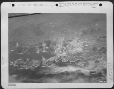 Consolidated > (AAF photo by Sgt. Robert George) 15th Army Air Force--AAF Boeing B-17 Flying Fortresses of the 15th U.S. Air Force blast harbor installations at Pola in Italy. In this oblique view, taken from the open hatch in the top of a Fortress radio