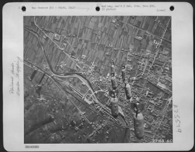 Thumbnail for Consolidated > 12TH AIR FORCE, December 26-- "BOMBS AWAY" and another Axis target feels the impact of power ful AAF attacks, as shown in the pictures. Marshalling yards at Prato, Italy, are shown before and after bombs are dropped from Martin B-26 Marauders