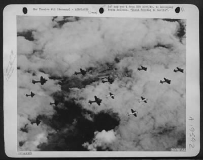 Thumbnail for Boeing > CLOUD HOPPING TO BERLIN: With breaks in the cloud banks below them affording only momentary glimpses of the earth, these Fortresses of the U.S. Army Air Forces wing their way to Berlin to take part in a history-making attack. The American heavy