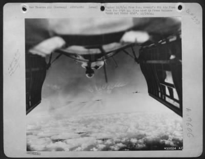 Thumbnail for Boeing > BOMB BAY DOORS OPEN-The open bomb bay doors of a Flying Fortress frame this view of B-17 bombers steady on the target for an attack on Merseburg/Leuna, German oil plant.