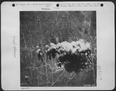 Thumbnail for Consolidated > After the raid, a pall of smoke hovers over the target. Reconnaissance pictures taken an hour and a half after the Flying Fortresses had left showed that considerable damage had been caused to the aircraft factory, steel mills and railway yards.