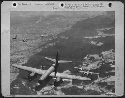 Martin > "Big-tailed birds" of the 1st Tactical Air Force Martin B-26 Marauder wing head homeward from a successful attack on an enemy fuel dump at Zell, Germany, 18 miles southeast of Strasbourg. In the left background can be seen smoke columns rising from