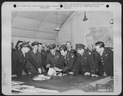 Thumbnail for General > Usaf And Raf Officers Study Aerial Photographs During The Visit Of Air Marshall Mallory (Third From Left) To The 386Th Bomb Group Base At Great Dunmow, Essex, England On 8 May 1944.