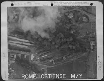 Thumbnail for Consolidated > BLASTING NAZI RAIL COMMUNICATIONS THROUGH ROME AND FLORENCE, ITALY. American bombing raids show how, with precision bombing, men of the U.S. Army 12th AF strike military targets. Heavy smoke billows up from bombs