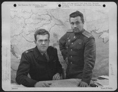 Thumbnail for General > Capt. Finchen And A Russian Officer Discuss Future Shuttle Bombing Missions To Be Flown From The Poltava Airbase In Russia, Sometime In November 1944.