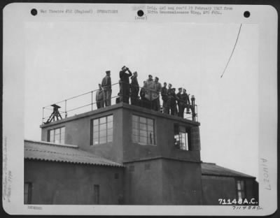 Thumbnail for General > From The Top Of The Control Tower At An 8Th Air Force Base In England, Men Of The 379Th Bomb Group Scan The Sky For Sight Of Boeing B-17 Flying Fortresses Returning From A Bombing Mission.  6 September 1943.