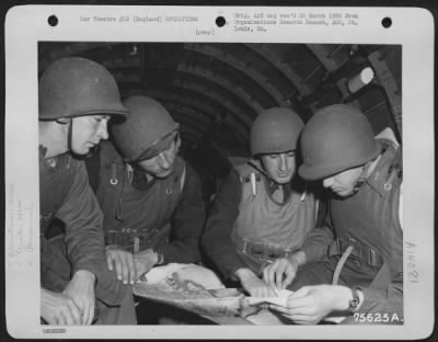 General > Colonel Young And Crew Of The 439Th Troop Carrier Group Study Their Target Map Aboard A Cargo Plane Prior To Taking Off From An Airbase Somewhere In England.  29 May 1944.