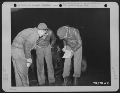 General > 1St Lt. J.M. Smith Of Austin, Texas, Pilot Of The Boeing B-17 "Our Gang" Signs The Pre-Flight Sheet Just Before Take Off On Another Bombing Mission From His Base At Bassingbourne, England.  M/Sgt. Albert P. Sokinas Of Minersville, Pa., (Extreme Left) Crew