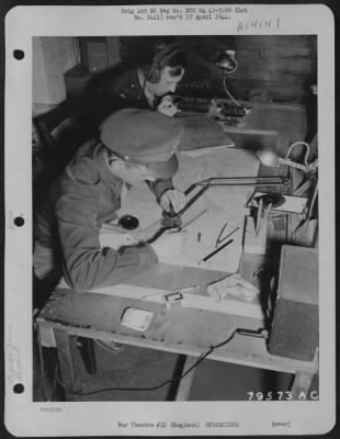 Thumbnail for General > John M. Walch Of Pittsburgh, Pa., Navigation Instructor And 1St Lt. Jesse L. Mayo Of Saratoga, Texas, Navigation Instructor, Are Seen At Work In The Control Room At An Airbase At Bovington, England.  22 July 1943.