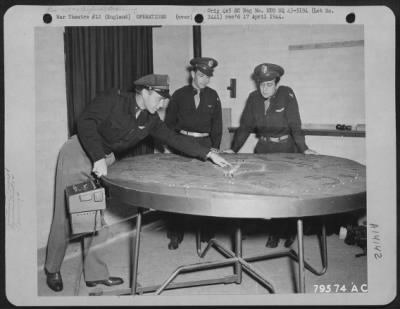 General > 1St Lt. James A. Long Of Rockwood, Tennessee (Center) Instructs 1St Lt. Frederick B. Farrell Of Caledonia, Ny., Left, And Lt. Roy A. Burton Of Kansas City, Missr., On Procedures Of Night Landing.  They Are Being Instructed On The Drem Lighting Table.  Bov