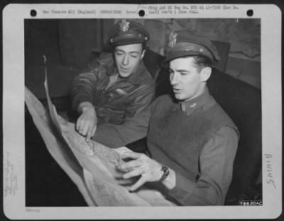 General > Lt. Albert A. Albino Of Aberdeen, Wash., And Lt. John J. Carroll Of Detroit, Mich., Both Members Of The 38Th Fighter Squadron Stationed At Nuthampstead, England, Discuss The Map Of A Future Target In The Squadron Pilot Room