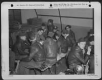 Thumbnail for Crew Members Of A Boeing B-17 "Flying Fortress" Are Interrogated After Their Return To Their Base In Framlingham, England, Following A Mission Over Germany.  Around The Table, Left To Right: S/Sgt. Harry M. Houck, Mullens, Wv; 2Nd Lt. Marshall, Loredo, Te - Page 1