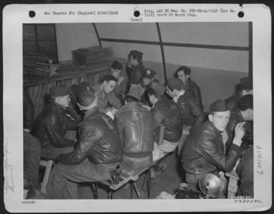 Thumbnail for General > Crew Members Of A Boeing B-17 "Flying Fortress" Are Interrogated After Their Return To Their Base In Framlingham, England, Following A Mission Over Germany.  Around The Table, Left To Right: S/Sgt. Harry M. Houck, Mullens, Wv; 2Nd Lt. Marshall, Loredo, Te