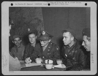 Thumbnail for General > Crews Of The 91St Bomb Group, Based At Bassingbourne, England, Are Interrogated After Their Return From A Mission Over Enemy Territory.  They Are, Left To Right: T/Sgt. John Kiss, Capt. Donald K. Sheeler, Capt. John K. Rickles Of Indianapolis, Ind., Intel