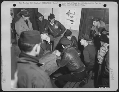 Thumbnail for General > At Ridgewell Field, Great Yeldham, England, Colonel M. Cross, Riverside, Calif., Combat Wing Commander, Left, (Hand On Face) Tells The Story Of The Recent Rhur Valley Raid To Capt. Joseph M. Murray, Bar Harbor, Maine, Center; Lt. Colonel Conway S. Hall, N