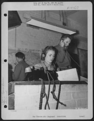 Thumbnail for General > Wac Pfc. Agnes Brite Of Bridgeton Nc And Cpl. William Fitzell Of New Britain, Conn. At Work In The Plotting Room At An 8Th Air Force Base At Watford, England.  11 January 1944.