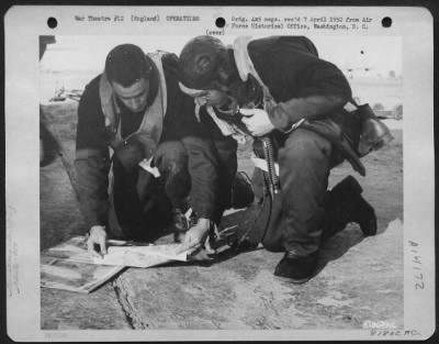 General > At An 8Th Air Force Base Somewhere In England, Two Crew Members Of The 458Th Bomb Group Hold A Last Minute Briefing Prior To Take-Off On Another Bombing Mission Against Enemy Targets, In Europe.  27 April 1944.