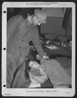 General > C.Q. (Charge Of Quarters) Wakes One Of The Crew Members Of The 303Rd Bomb Group Who Will Participate In The Day'S Bombing Mission.  England, 9 Dec. 1944.