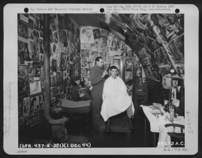 Thumbnail for General > A Multitude Of Pin-Up Pictures Adorning The Wall Of The 533Rd Bomb Squadron Barber Shop Catches The Eye Of The Customer As The Barber Gives Him A Trim. 381St Bomb Group, England, 1 December 1944.