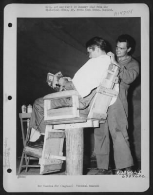 Thumbnail for General > A G.I. Reads The Latest Edition Of 'Yank' While Getting A Trim At The 386Th Bomb Group Barber Shop At A Base In England On 18 August 1943.