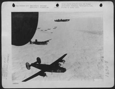 Thumbnail for Consolidated > A Formation Of Consolidated B-24 Liberators Of The 392Nd Bomb Group Wing Their Way Over A Blanket Of Clouds En Route To Bomb Enemy Installations In Bielefeld, Germany.  10 March 1945.