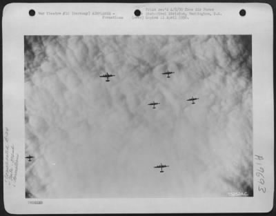 Consolidated > A Formation Of Consolidated B-24 Liberators Of The 392Nd Bomb Group Wing Their Way Over A Blanket Of Clouds En Route To Bomb Enemy Installations In Ludwigshaven, Germany.  2 December 1943.