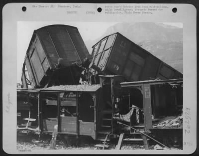 Thumbnail for Consolidated > Some Up-Turned Trains In The Marshalling Yards At Mantove, Italy, Completely Knocked Out By 12Th Air Force Planes.