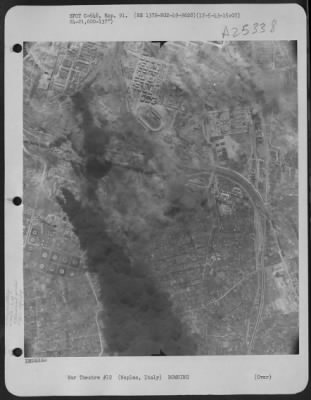 Thumbnail for Consolidated > After Planes Of The 2Nd Bomb Group, 49Th Bomb Squadron, 15Th Air Force Have Left Their Target At Naples, Italy On 17 May 1943, Smoke Billows Up From The Marshalling Yards And Oil Storage Tanks.