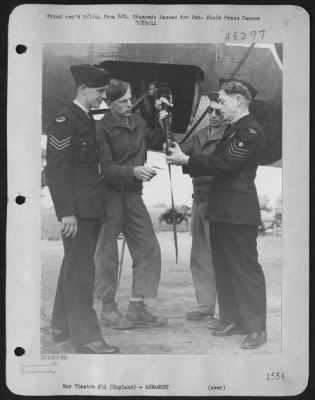 Thumbnail for General > Two 9Th Af Gunners Who Are Assigned To Marauder Medium Bombers Operating On Night Missions Over Europe, Are Getting Some Valuable 'Gen' From Two Experienced Gunners On Royal Air Force Mitchell Bombers.  From Left To Right Are: Sgt. George Olsen, Egg Lake,