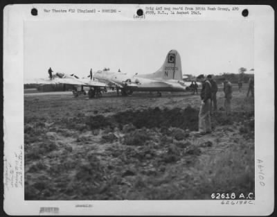 Thumbnail for Greatashfield > Bomb Damage To Hangar On Aaf Base, 385Th Bomb Group, England.  Note Boeing B-17 "Flying Fortress" In Background.