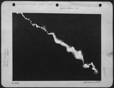 V-1 Over England > The Flaming Wake Of A German Flying Bomb As It Plunged Toward The Earth.  Setting Up A Time-Exposure, Seconds Before The Bomb Started Its Power Dive, The Photographer Ran To A Near By Shelter And Arrived There As The Weapon Exploded In An Adjacent Clearin
