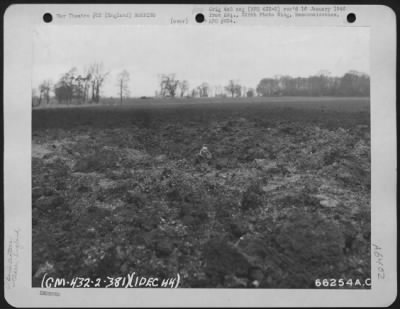 Clare > A Man Standing In A Crater Gives One An Idea Of The Depth Of The Crater Made By A German Rocket Which Hit Near Clare, England On 1 December 1944.