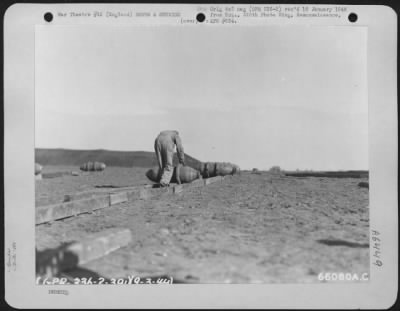 General > Rolling Bombs Into Camouflaged Bomb Dump Of The 381St Bomb Group At 8Th Army Air Force Station 167 In England, 9 March 1944.