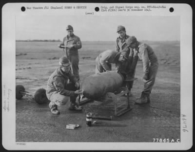 Thumbnail for General > Ordnance Members Of An 8Th Air Force Heavy Bomb Group Fusing The Nose And Tail Of A 1000 Lb. Bomb At An Airbase At Thurleight, England.  1943.