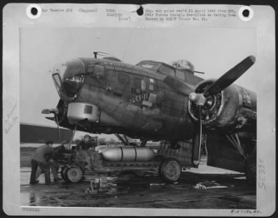 General > A Carrier Brings The Bombs Into Position To Be Loaded Into The Boeing B-17G "Flying Fortress" 'E-Rat-Icator', A Veteran Of 125 Missions.  It Presented A New Problem In Loading Due To Its Awkward Size And Its High Sensitivity.