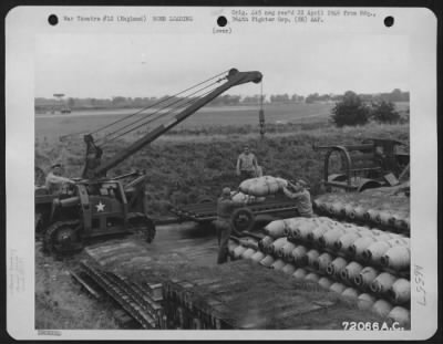 Thumbnail for General > Five Hundred Pound Bombs Are Hoisted Onto A Trailer From A Dump Of The 364Th Fighter Group, 67Th Fighter Wing At 8Th Air Force Station F-375, Honnington, England.  4 September 1944.