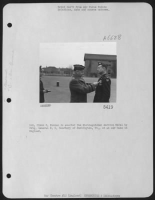 Awards > Colonel Glen E. Duncan Is Awarded The Distinguished Service Medal By Brig. General M.C. Woodbury Of Burlington, Vt., At An Air Base In England.