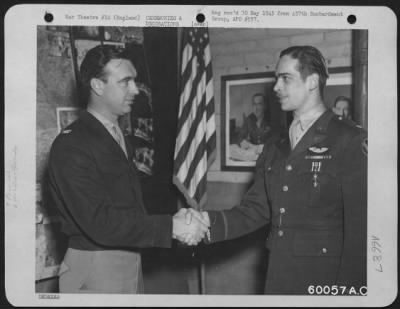 Awards > Colonel Harris Edward Rogner Presenting The Distinguished Flying Cross To Major Snow At An 8Th Air Force Base In England.