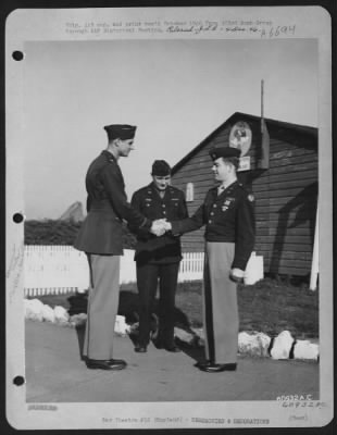 Thumbnail for Awards > 1St Lt. R.M. Garret, 358Th Bomb Squadron, 303Rd Bomb Group, Receiving The Distinguished Flying Cross At An Air Base In England.  15 April 1945.