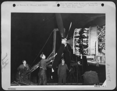 Thumbnail for Propellers > FRANCE-Mechanics at a First Tactical AF Air Depot change the four-bladed propeller on a Republic P-47 Thunderbolt fighter-bomber with the aid of a remover made from a ofrmer German carry-jack. Its designer, M-Sgt. Charles D. Groff, Washington Court