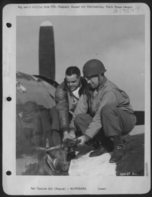 Thumbnail for Refueling > Here, Maj. Gen. E.R. Quesada, Commanding, 9th Fighter Command, is seen helping refuelling a plane after landing on the emergency strip in Cherbourg Peninsula. With him is Lt. Col. Frank S. Perego of Canandaigua, N.Y., who was among the first on the