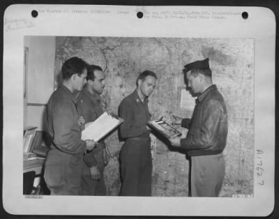 Thumbnail for General > In the Intelligence Officer of the 9th AF base operating somewhere in France is Lt. Col. Richard B. Hibbert of Ronceverte, W. Va. He is briefing his personnel. Left to right are: Sgt. Paul F. Bertaccini, Litchfield, Conn.; S/Sgt Harold B. Green