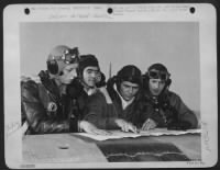 Thumbnail for Lt. Col. Marshall Cloke, (second from right) a squadron commander in the 354th fighter-bomber group, checks last minute details with his flight-leaders just before an attack against German supply and communications lines. The scene is a front line - Page 1