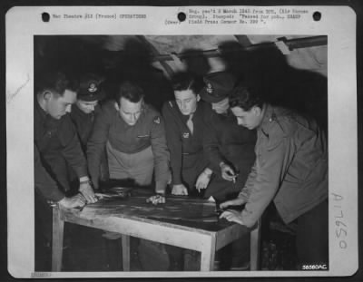 Thumbnail for General > Just before taking off on a high altitude photo mission over Germany, Allied recon. Pilots of the First Tac/AF plot their courses on a map of the assigned area. The U.S.A.A.F., R.A.F., and French Air Force airmen are, left to right: Capt. James F.