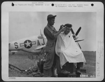 Thumbnail for General > A Mustang in the background, packing case for a chair and the sky for light are standard equipment for this barber at a 9th AF base in France. Barber is Sgt. Jerry H. Williams of Samaria, Idaho, while his customer is Sgt. Thomas Watters of Kearny